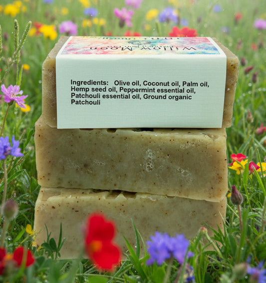 stack of 3 bars of Little Hippie soap top one has a label showing the ingredients