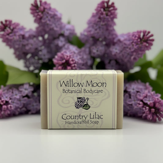 Bar of soap with 'Willow Moon Botanical Bodycare' packaging on a white background